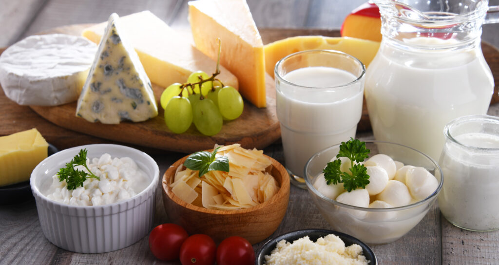 Milk, cheese, and other dairy foods on a table