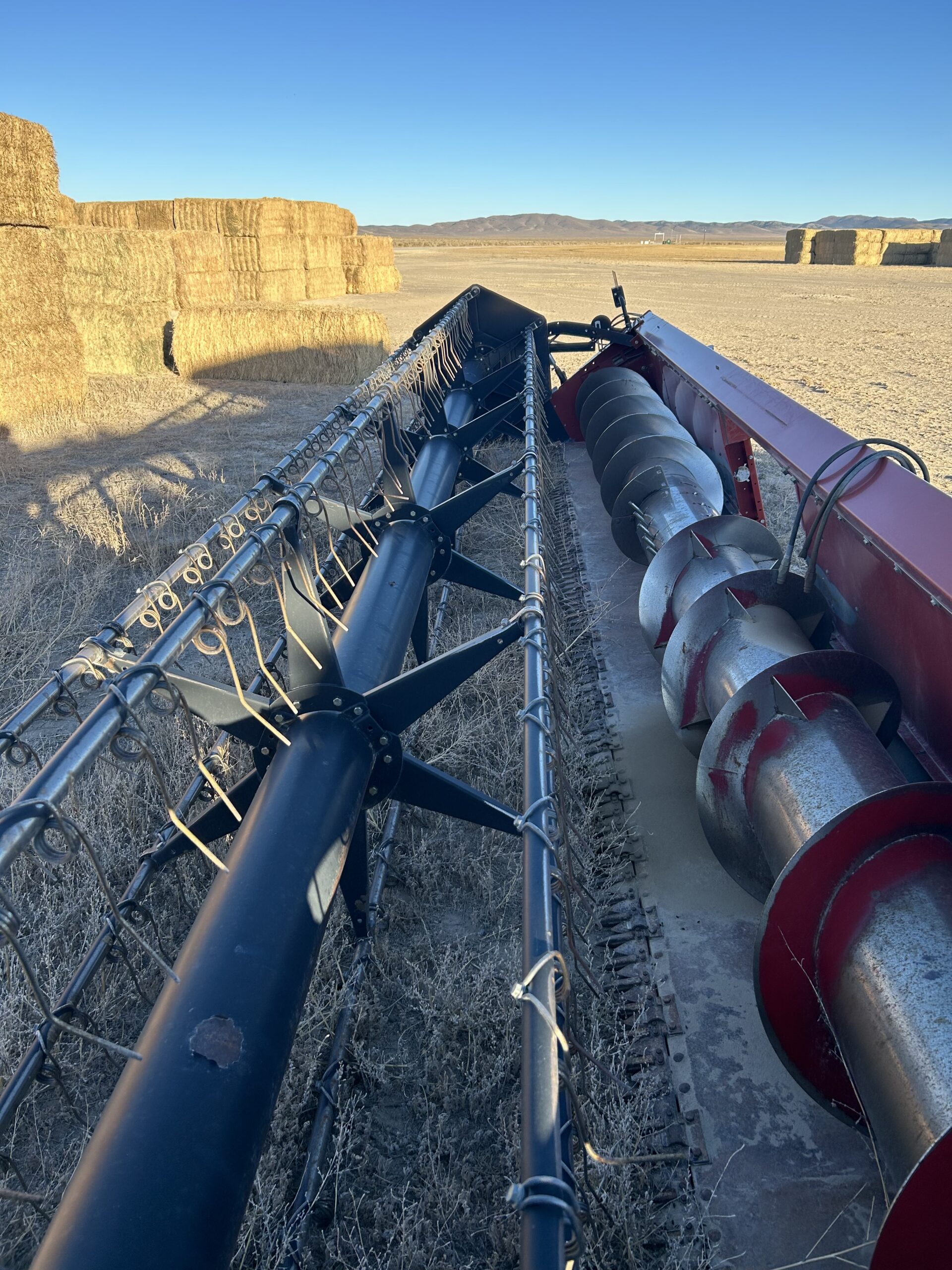 Farm equipment and hay handling area at Silver Lion Farms in Nevada